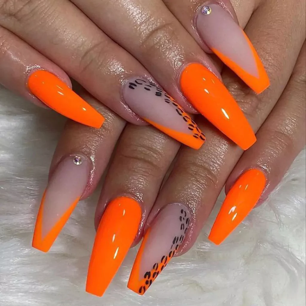 sophisticated nail designs with an orange theme 