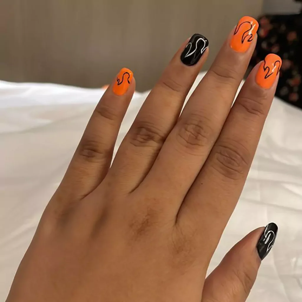 captivating nail designs with an orange theme 