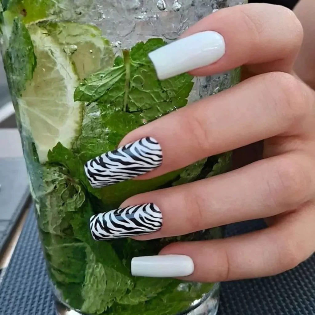 delicate nail designs with a zebra theme 