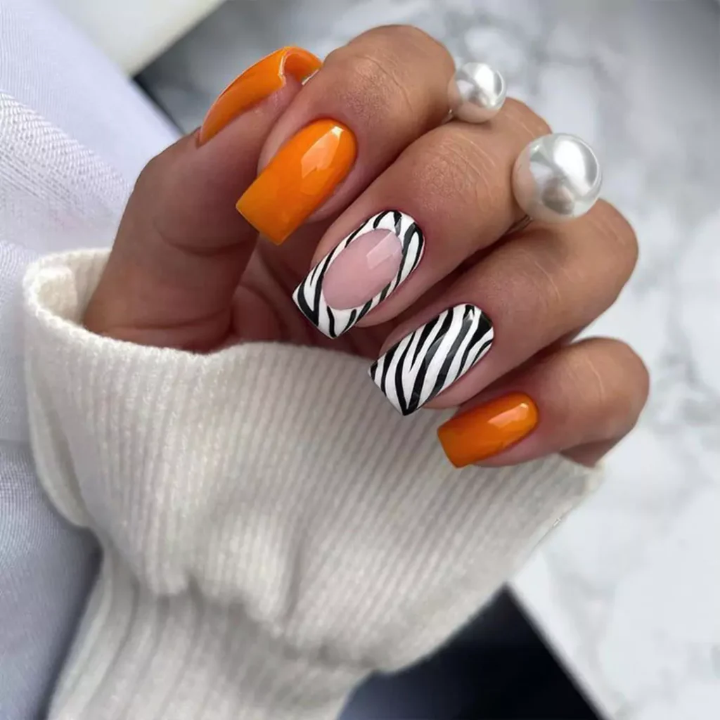 dazzling nail designs with a zebra theme 