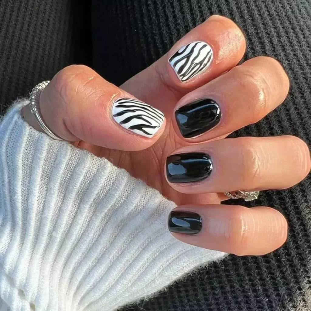 sparkling nail designs with a zebra theme 