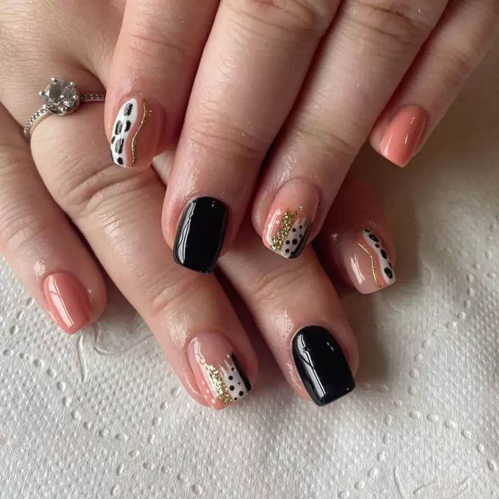 whimsical black and peach nail designs