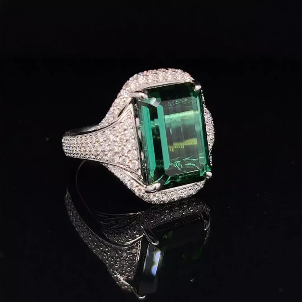 sparkling gold rings with square green gemstones 