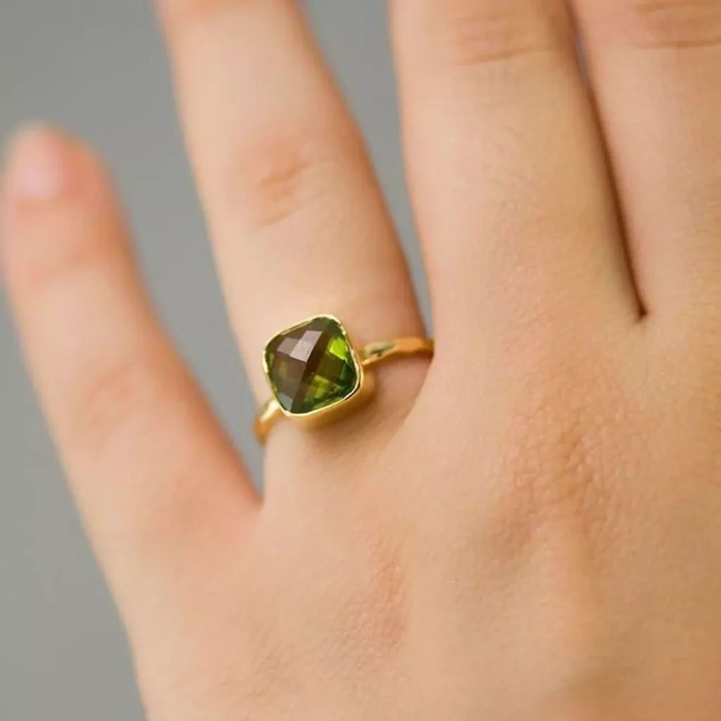 elegant gold rings with square green gemstones 