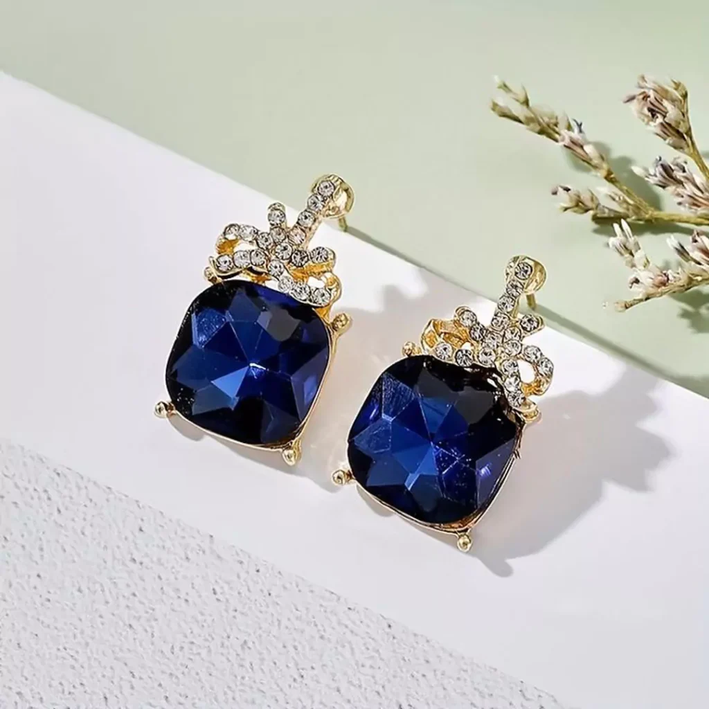 Deceptive earring models with blue gems