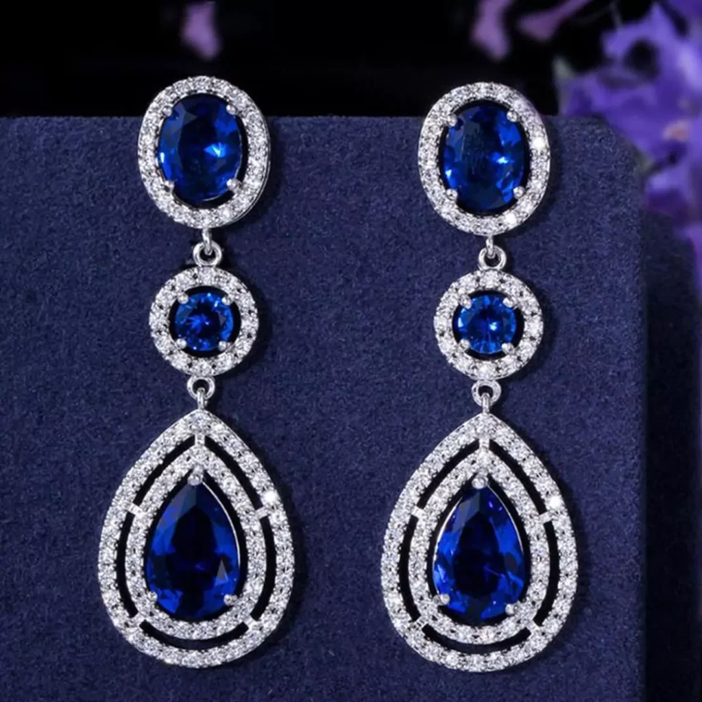 Delicate earring models with blue gems