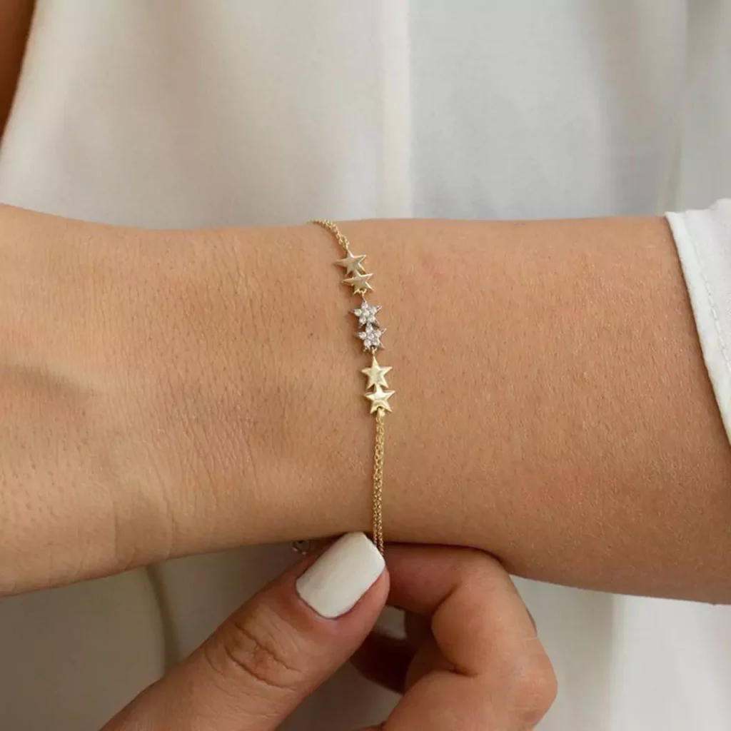 regal gold bracelets with star designs for women 