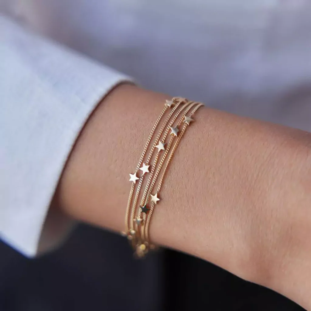 majestic gold bracelets with star designs for women 