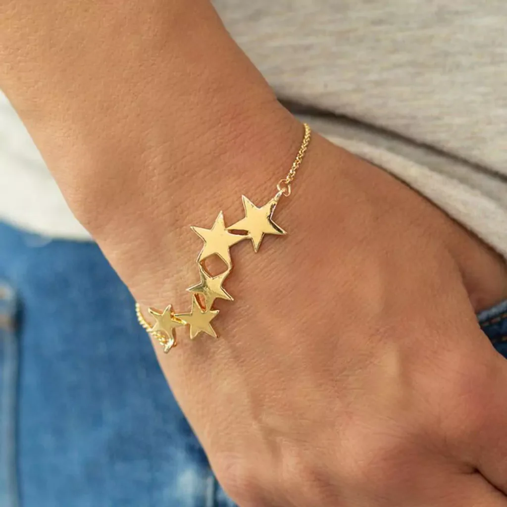 sophisticated gold bracelets with star designs for women 