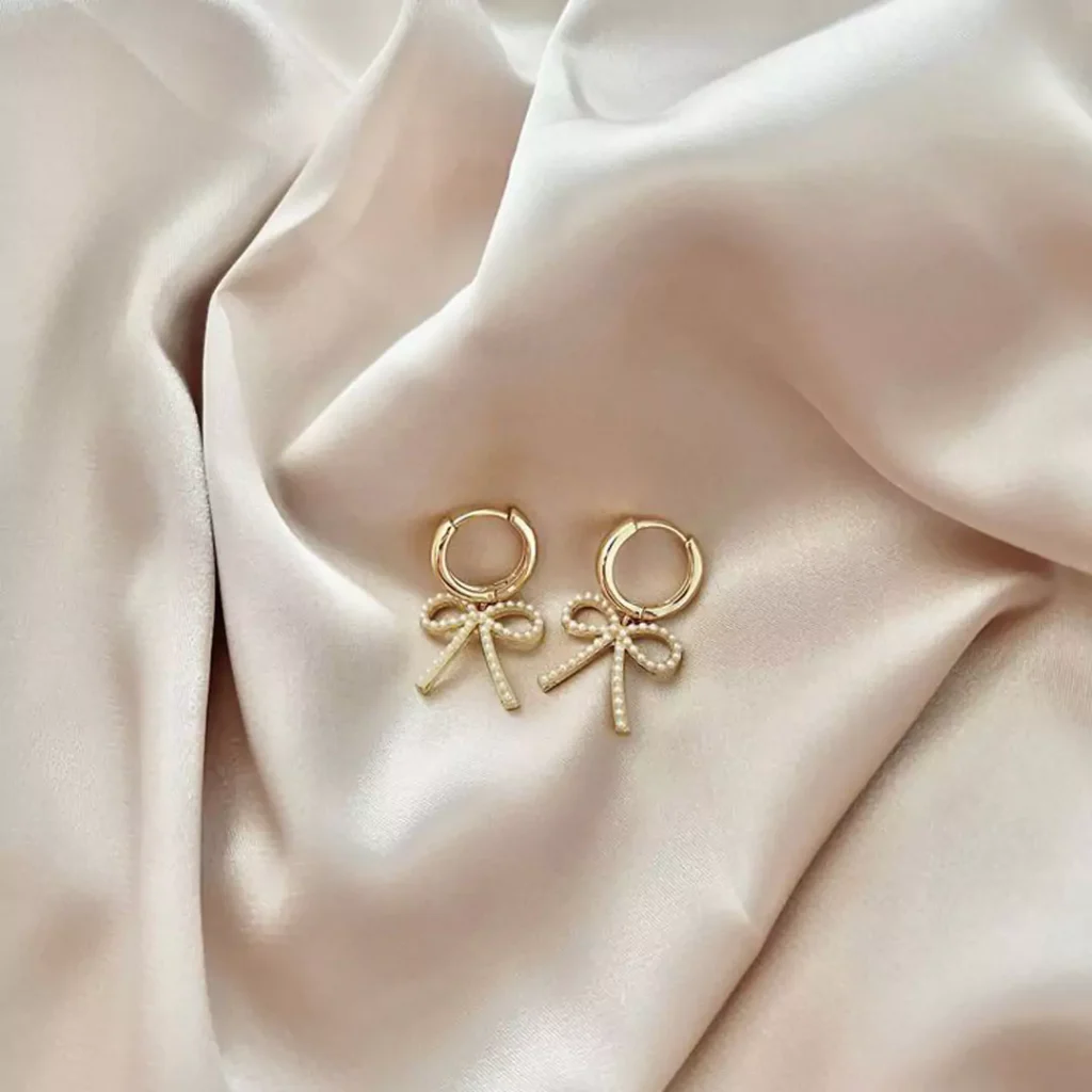 opulent gold bow earrings