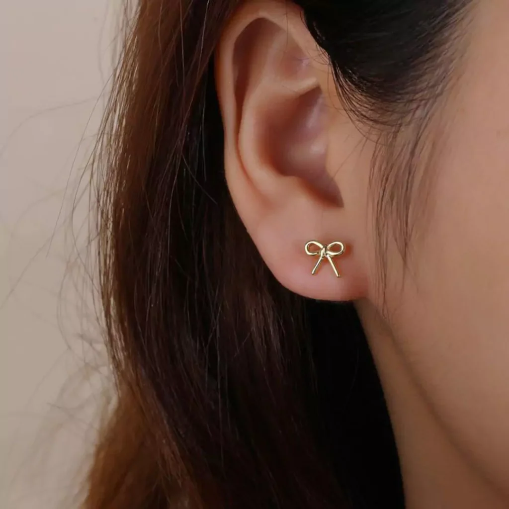 refine gold bow earrings