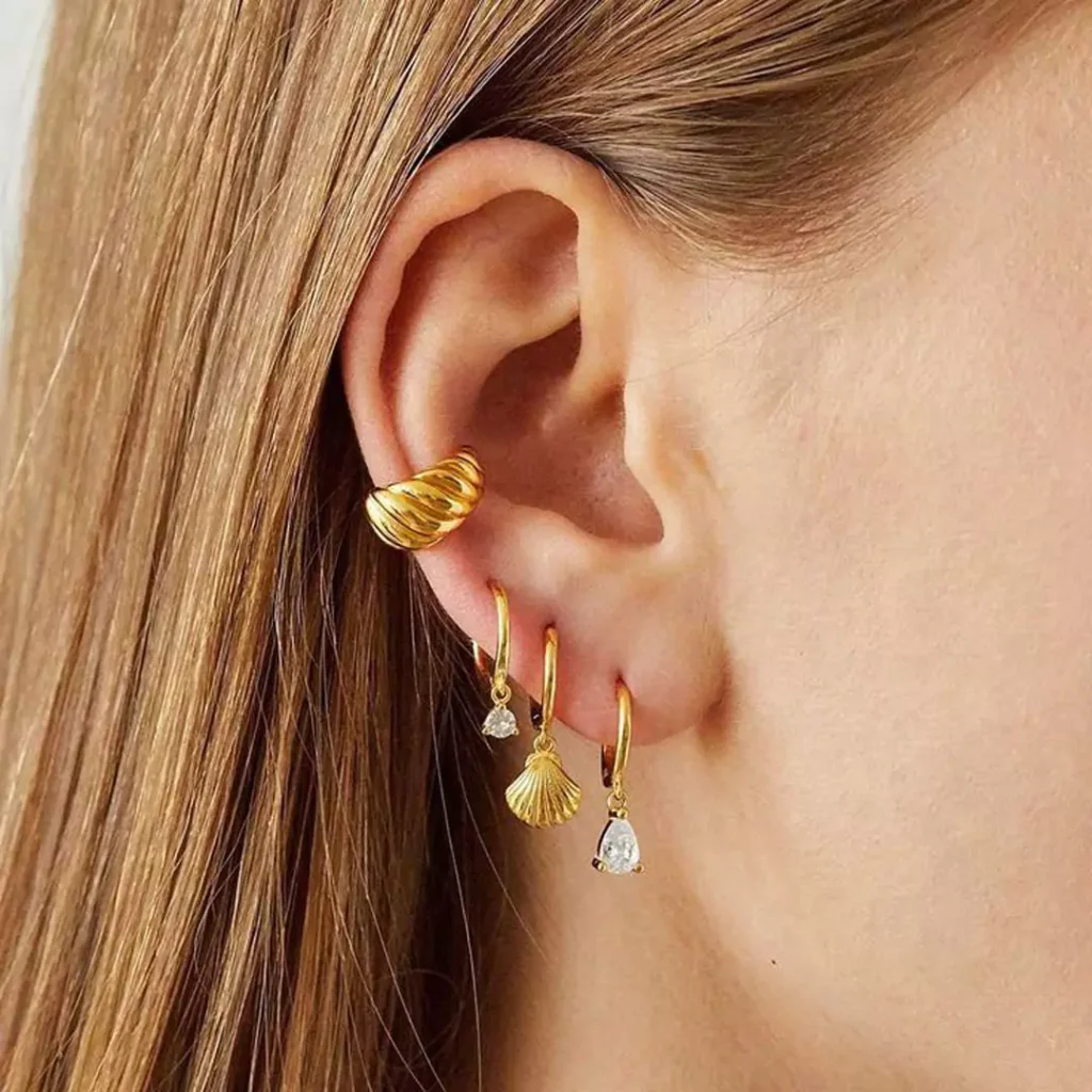 delicate gold shell hoop earrings